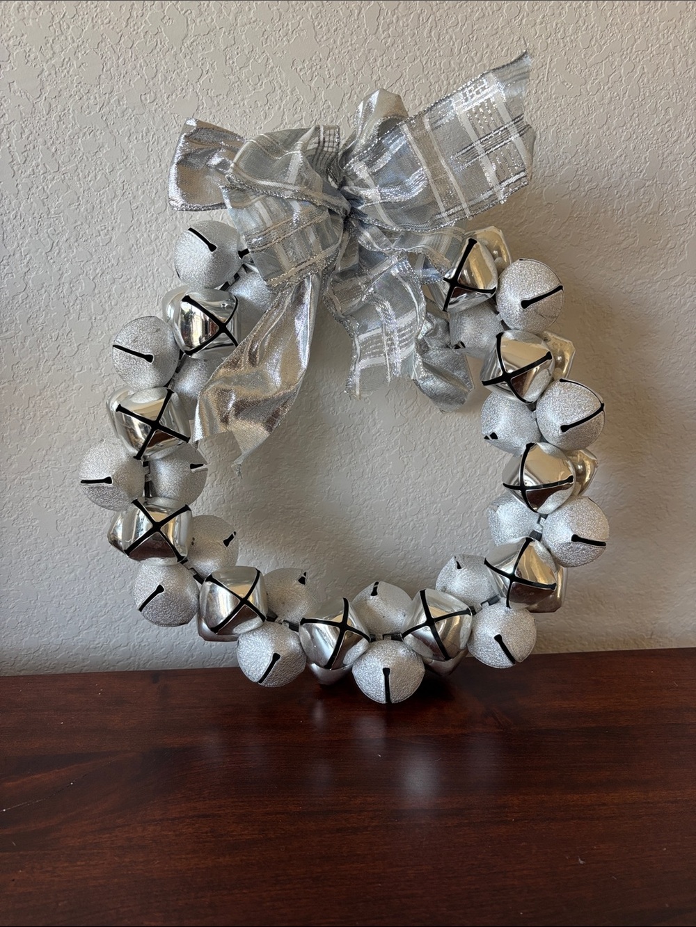 Silver Jingle Bell Holiday Wreath with Bow